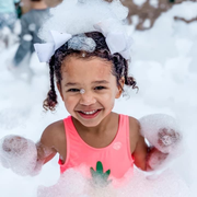 kid smiling in foam